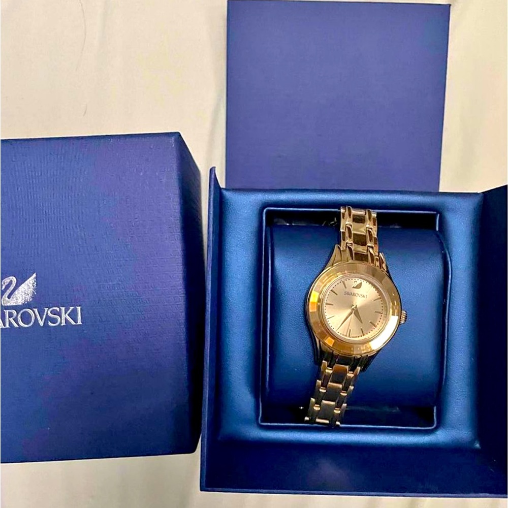 New Swarovski gold watch